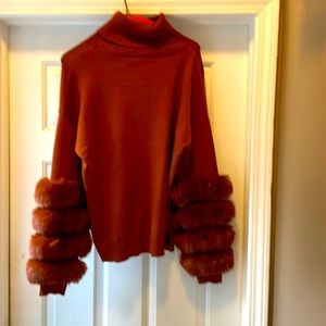 Rust color sweater with fur on arms